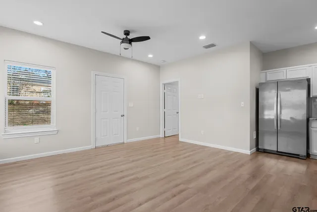 a view of an empty room with a window