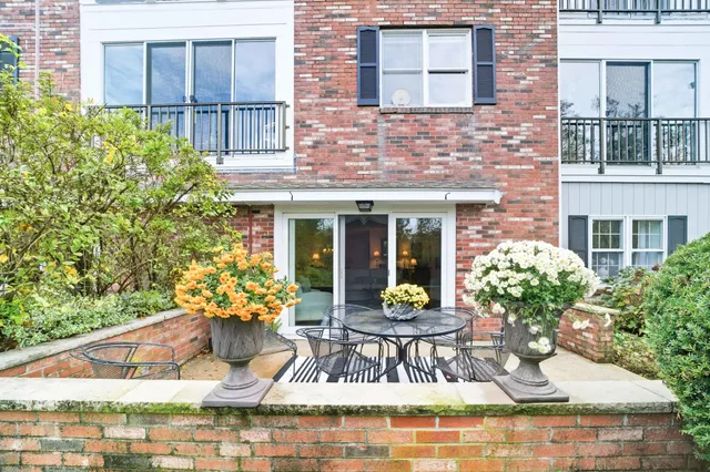 a view of a house with outdoor seating