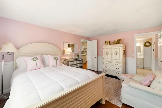 a bedroom with a bed and a couch