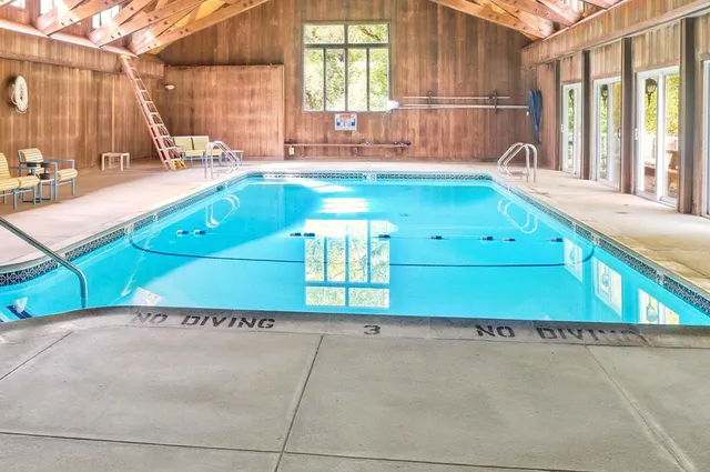 a bathroom with a tub sink and window