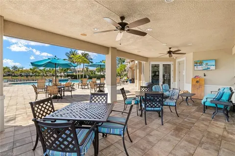a view of a patio with a dining table and chairs