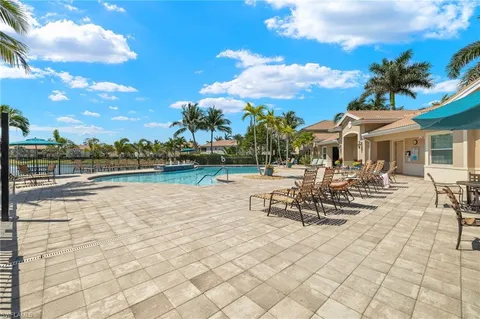 a view of a lake with outdoor seating