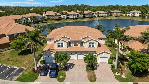 an aerial view of a house with a lake view