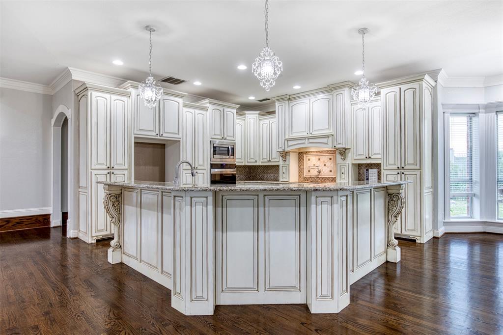 124 Lonesome Trail Haslet, TX 76052 - Photo 16 of 40 a kitchen with stainless steel appliances granite countertop a refrigerator a stove a sink and a microwave