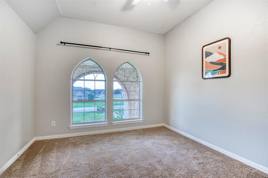 124 Lonesome Trail Haslet, TX 76052 - Photo 29 of 40 an empty room with windows and closet