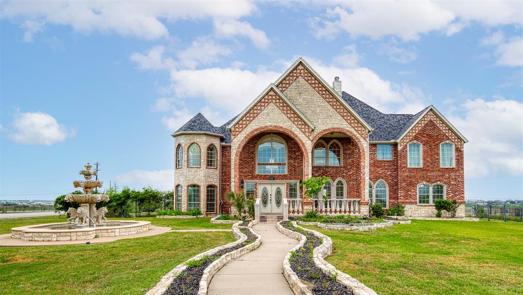 124 Lonesome Trail Haslet, TX 76052 - Photo 3 of 40 a front view of a house with a yard