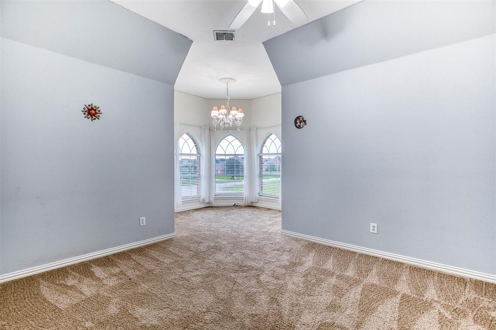 124 Lonesome Trail Haslet, TX 76052 - Photo 35 of 40 an empty room with windows and entrance