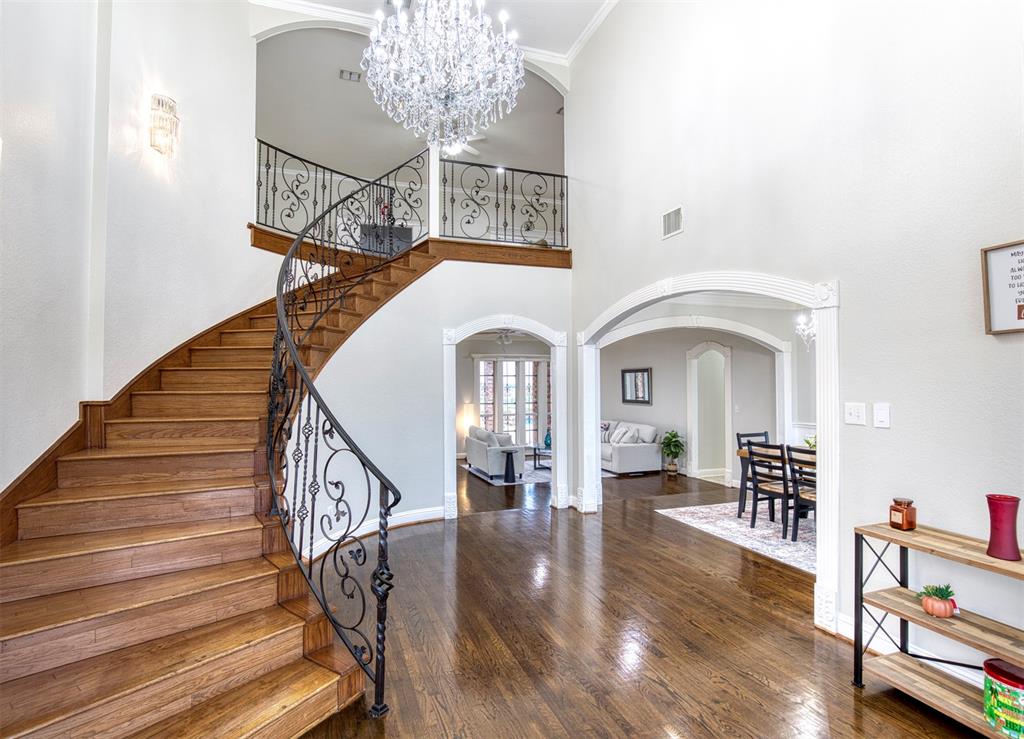 124 Lonesome Trail Haslet, TX 76052 - Photo 6 of 40 a view of a livingroom with wooden floor and furniture