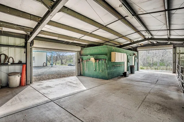 a view of a field with an trees in the background