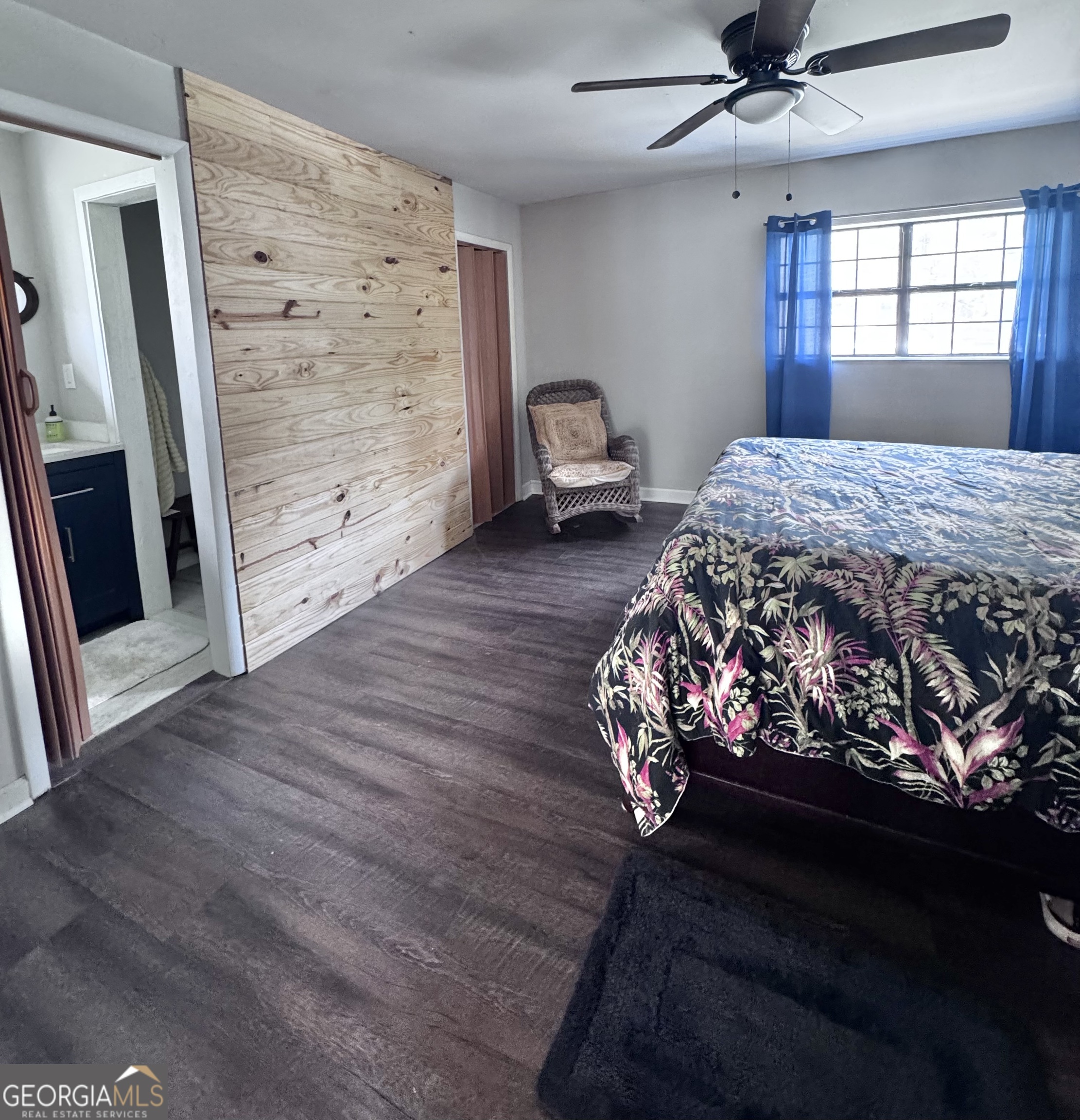 1427 & 1427c Magnolia Road Reidsville, GA 30453 - Photo 13 of 18 a bed sitting in a bedroom next to a window