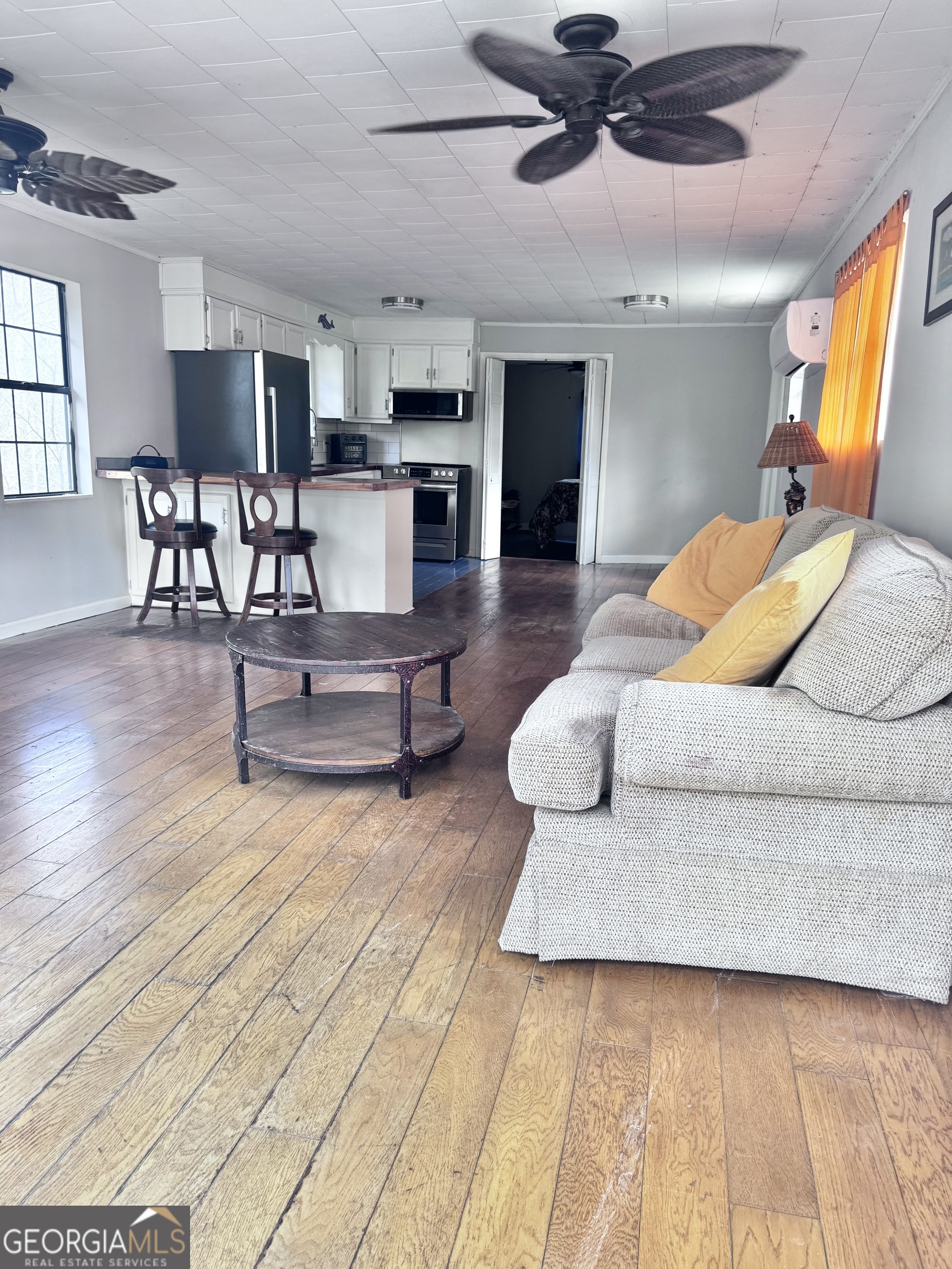 1427 & 1427c Magnolia Road Reidsville, GA 30453 - Photo 15 of 18 a living room with furniture and kitchen view