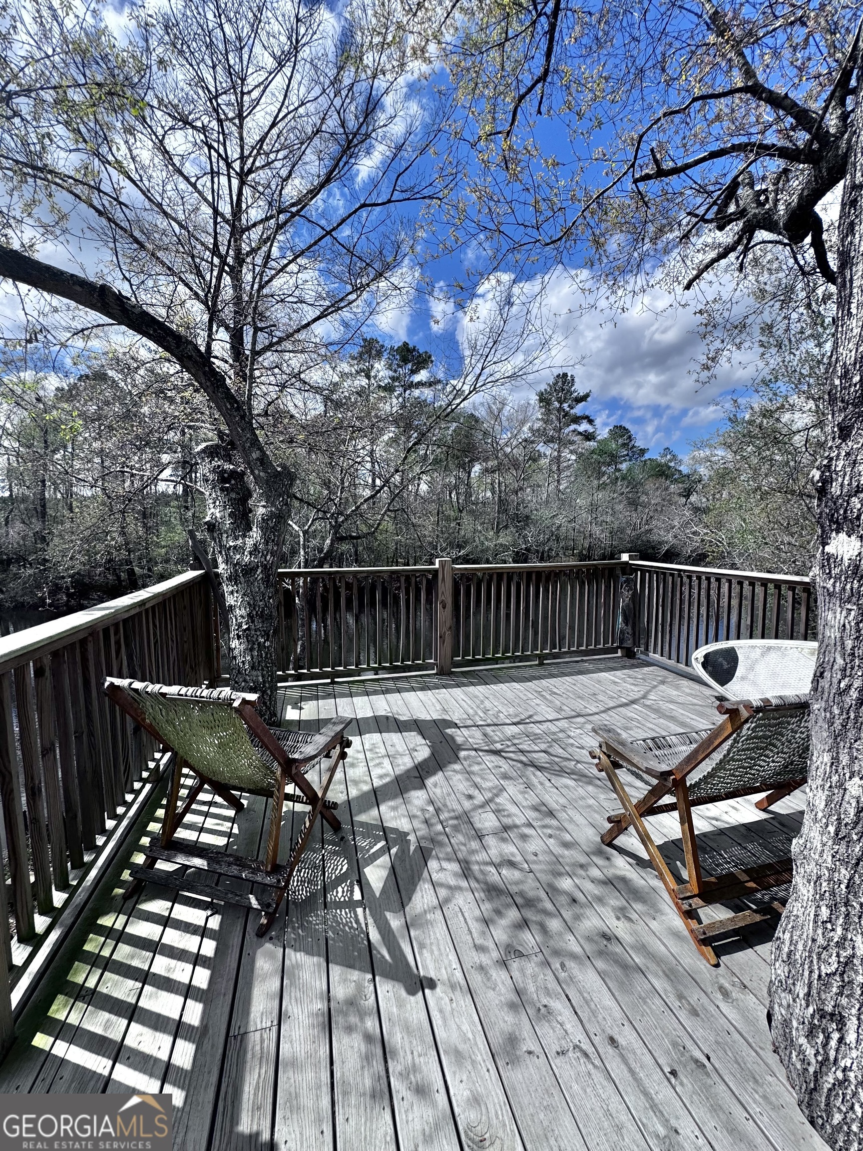 1427 & 1427c Magnolia Road Reidsville, GA 30453 - Photo 18 of 18 a view of a roof deck with wooden floor and fence