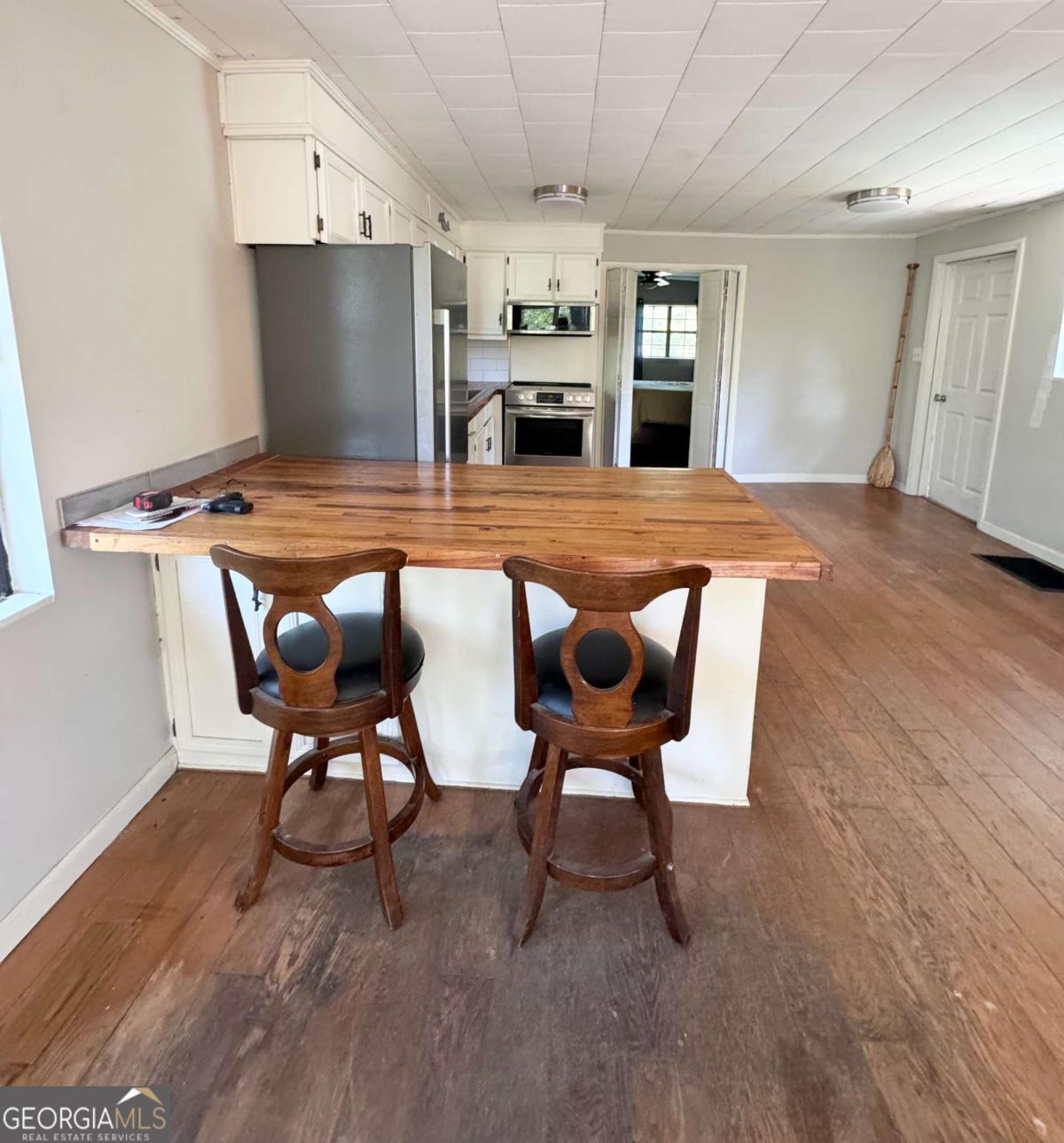 1427 & 1427c Magnolia Road Reidsville, GA 30453 - Photo 6 of 18 a view of kitchen with furniture and wooden floor