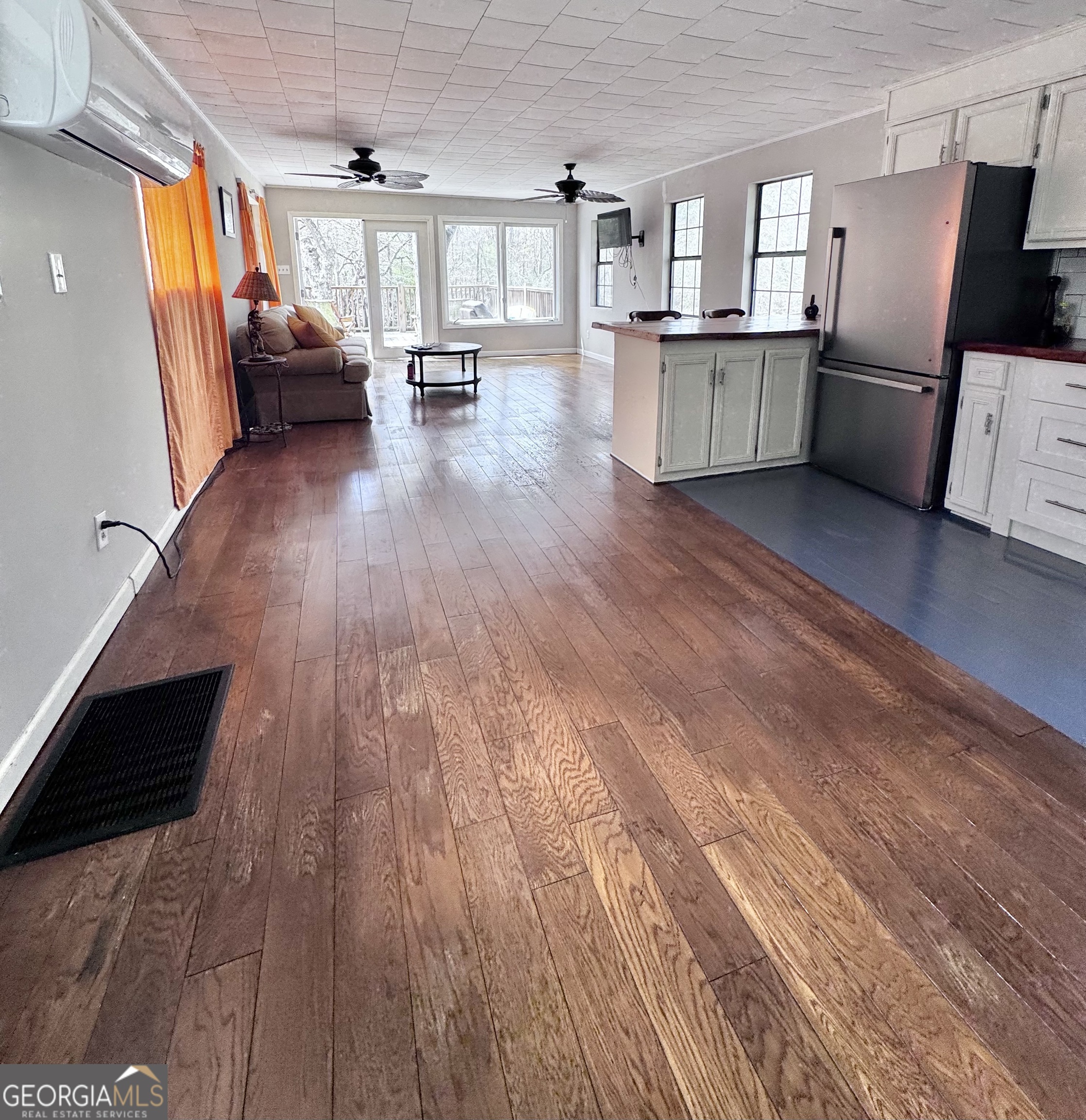 1427 & 1427c Magnolia Road Reidsville, GA 30453 - Photo 7 of 18 a view of living room with furniture and wooden floor