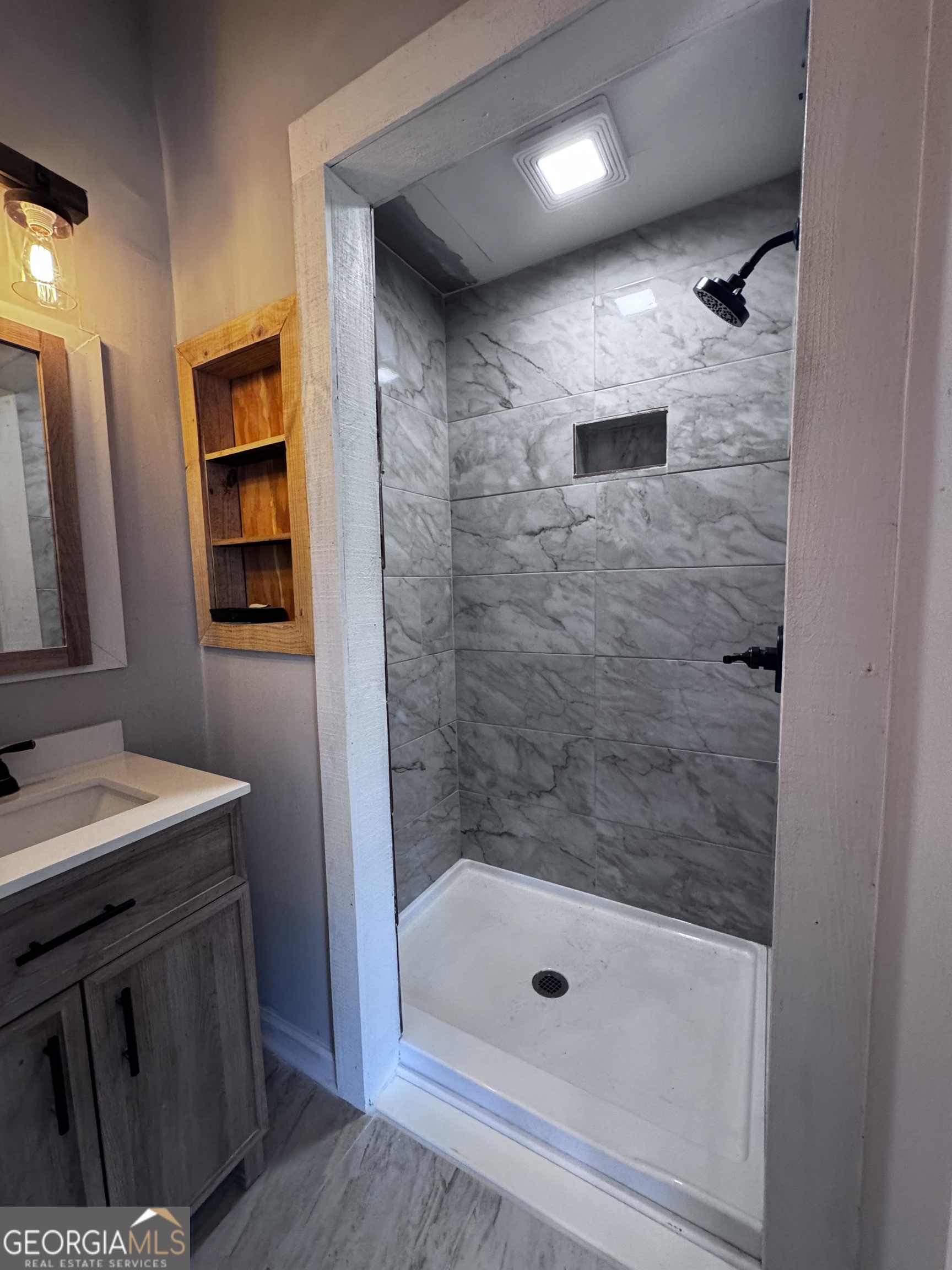 1427 & 1427c Magnolia Road Reidsville, GA 30453 - Photo 10 of 18 a bathroom with a shower and a sink