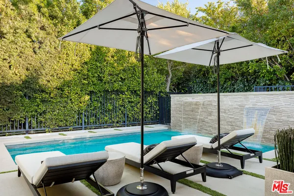 a view of backyard with seating space
