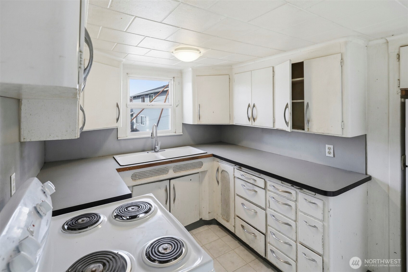 1817 34th Street Everett, WA 98201 - Photo 7 of 19 a kitchen with appliances cabinets and a stove top oven