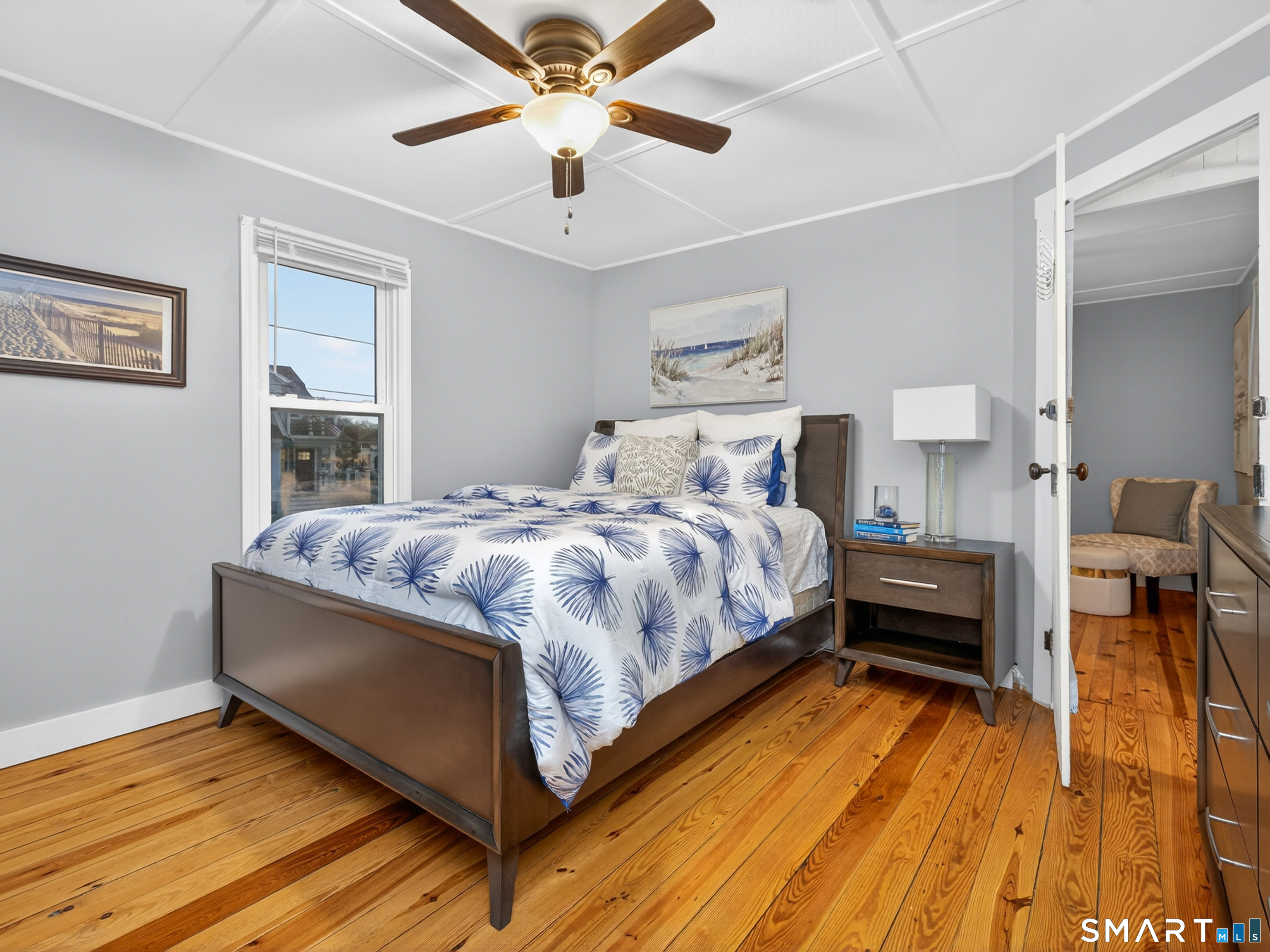 31 Old Colony Road Old Lyme, CT 06371 - Photo 18 of 38 a bedroom with a bed and wooden floor
