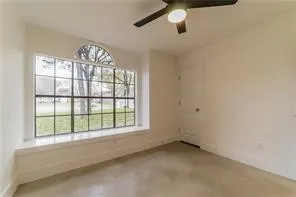 an empty room with windows water heater and windows