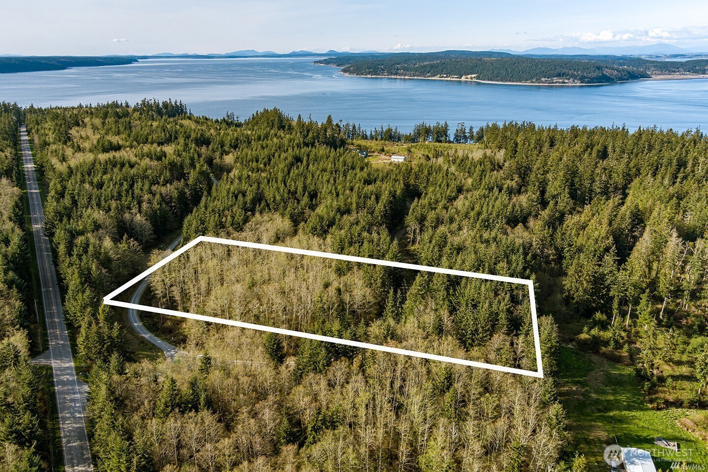 16 Water Vw Road Langley, WA 98260 - Photo 1 of 5 a view of a swimming pool with a lake view