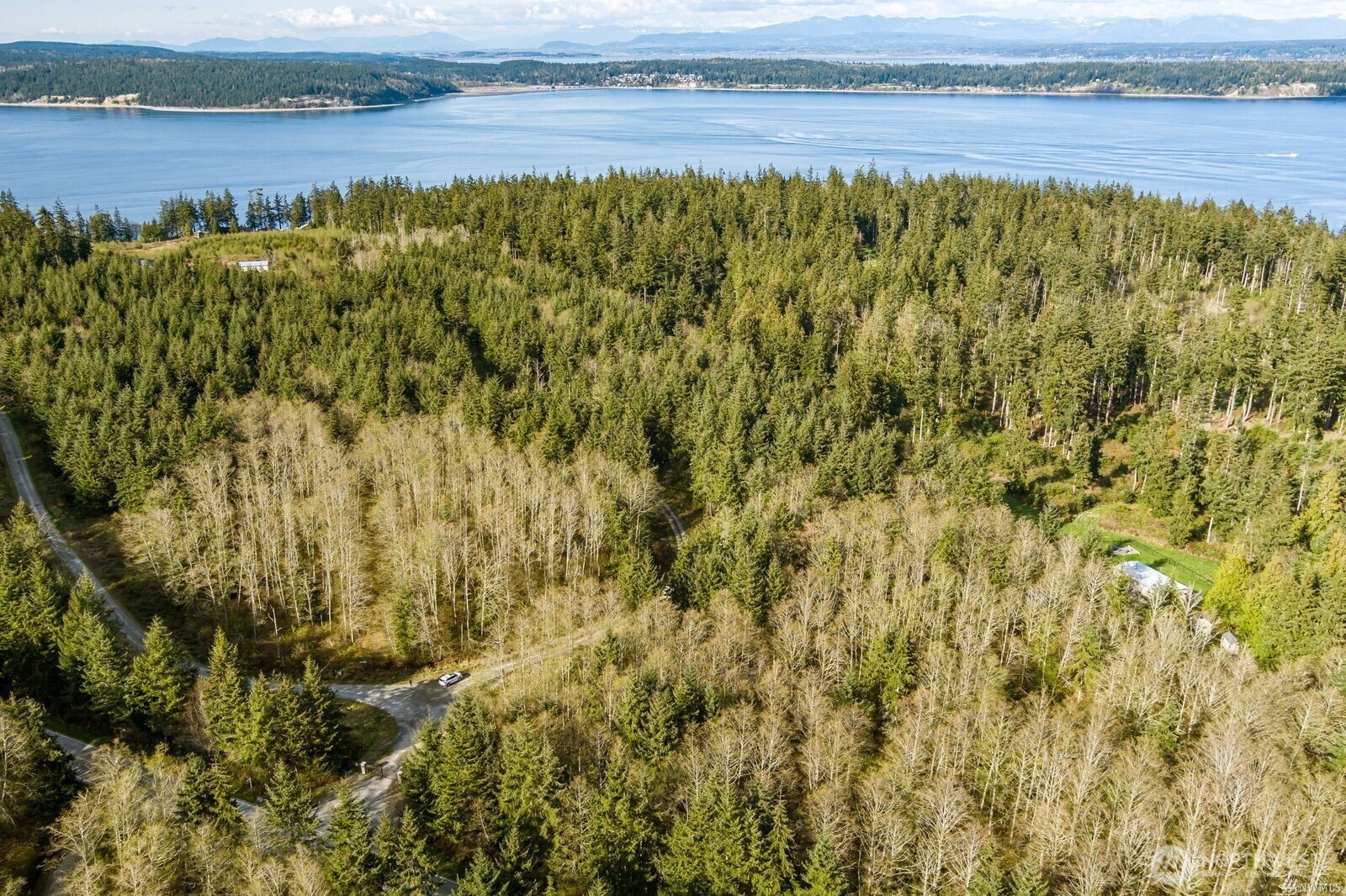 16 Water Vw Road Langley, WA 98260 - Photo 4 of 5 a view of a lake with an outdoor space