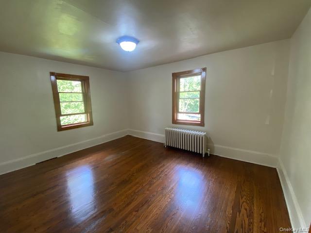 72 North Liberty Drive, Unit 2 Stony Point, NY 10980 - Photo 2 of 12 an empty room with wooden floor and windows