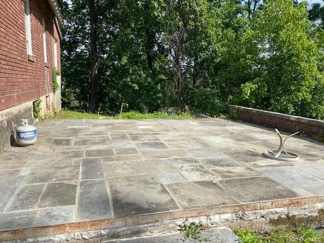 a view of a backyard of the house