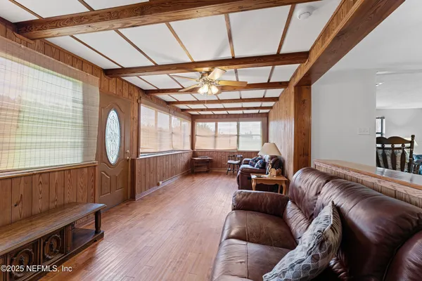 a living room with furniture and a window
