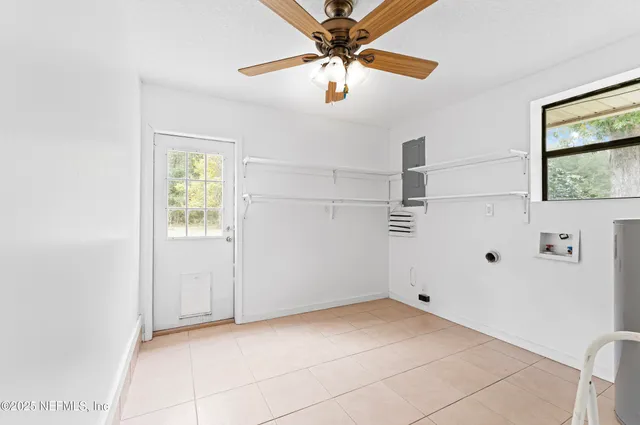 a view of a storage & utility room with a window