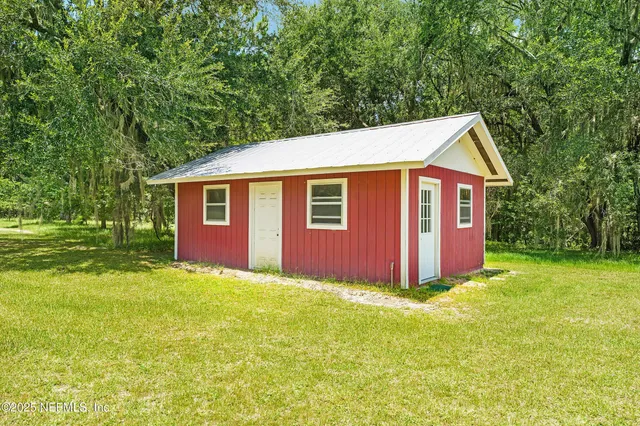 a view of a room with wooden walls