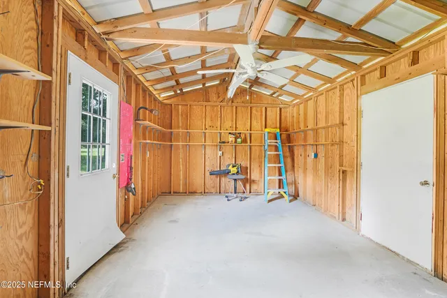 a view of an house with backyard and swimming pool