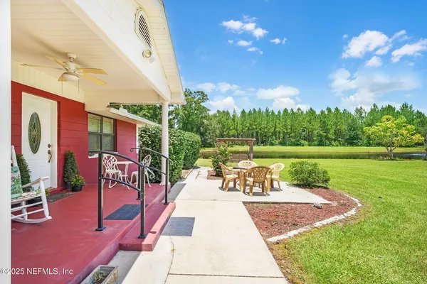 a view of a swimming pool with a patio