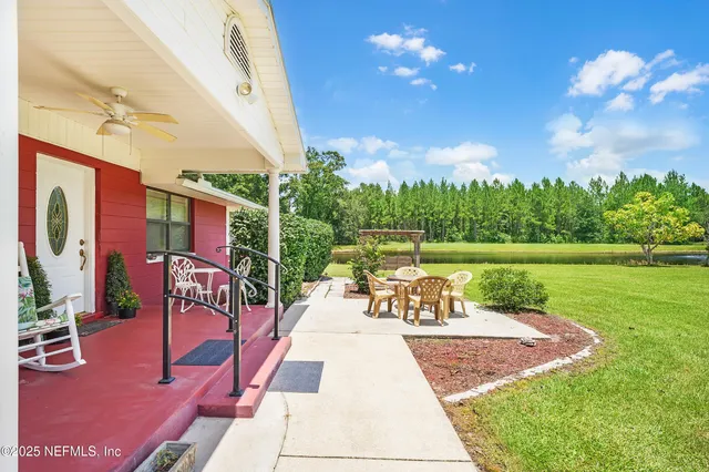 a view of a swimming pool with a patio