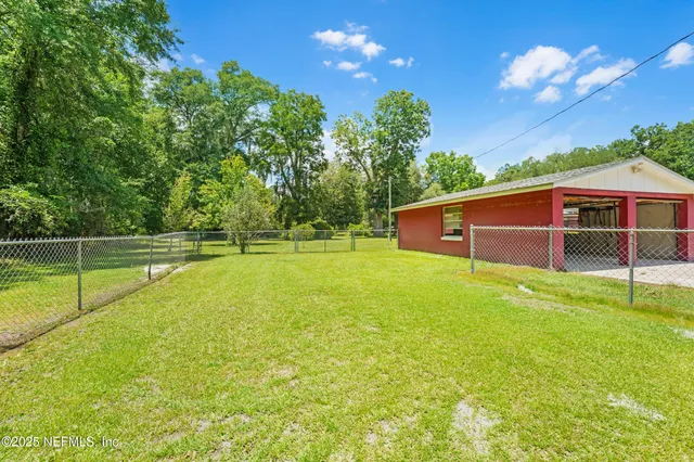 a view of a balcony with floor to ceiling window and stairs