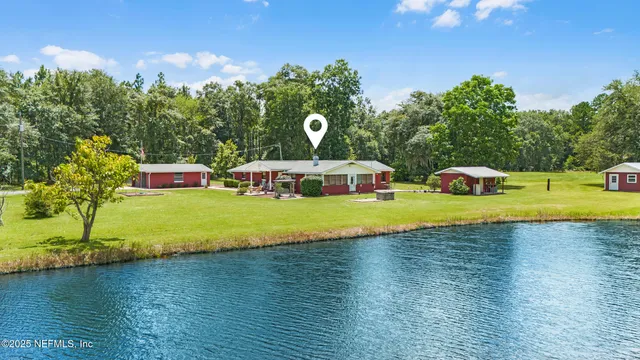 a view of a lake with a yard