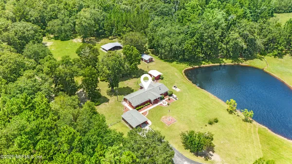 an aerial view of residential house with outdoor space