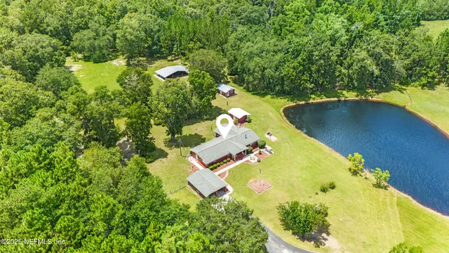 an aerial view of residential house with outdoor space