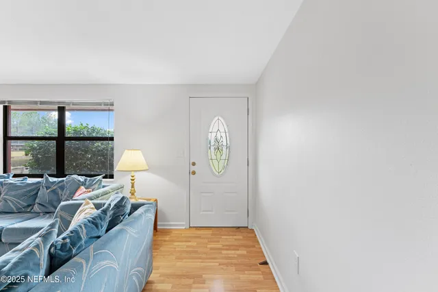 a living room with furniture and a window