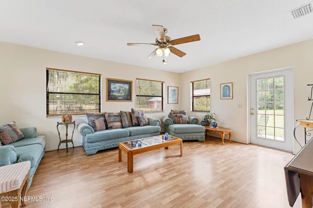 a living room with furniture and a window
