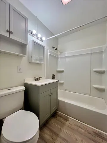 a bathroom with a toilet sink and bathtub