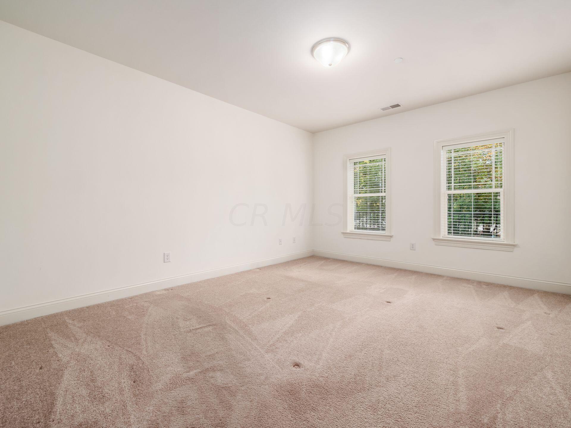 3175 Tremont Road, Unit 211 Columbus, OH 43221 - Photo 13 of 39 Primary suite with walk-in closet and en-suite bath