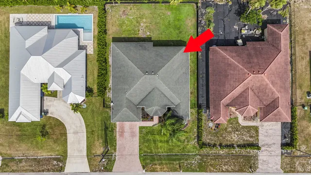 an aerial view of houses with outdoor space