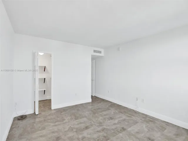 a hallway with a white walls