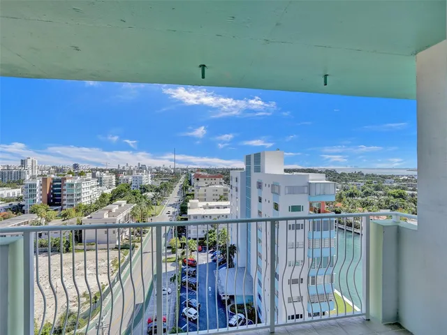 a view of a lake with tall buildings
