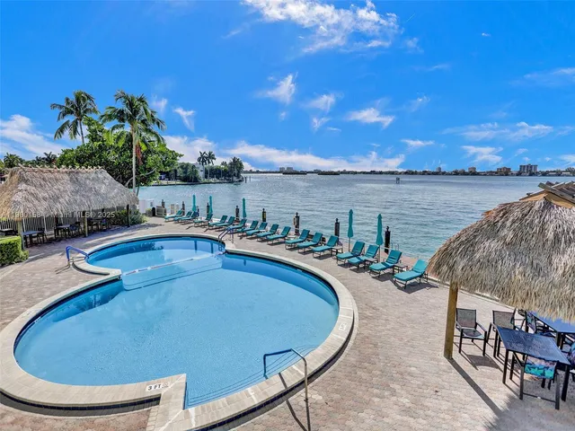 a view of a swimming pool with lounge chair