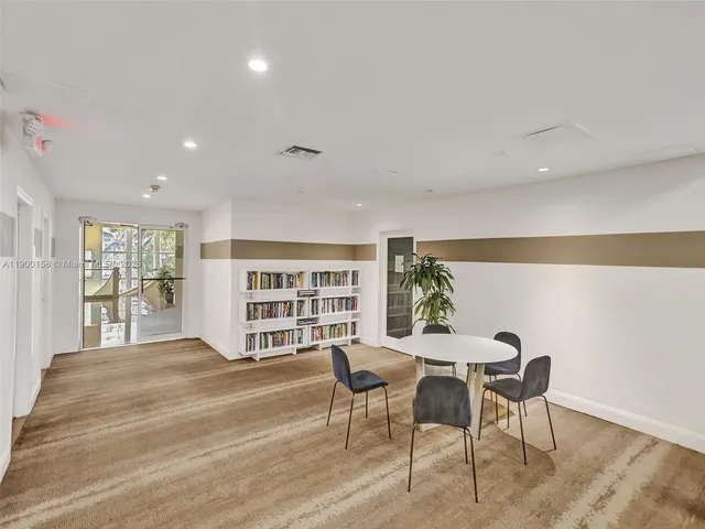 a view of an apartment with a yard