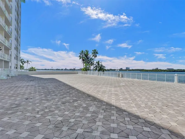 a view of a swimming pool with an outdoor seating