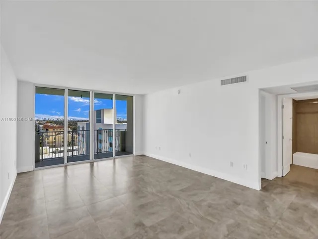 a view of a livingroom with a kitchen