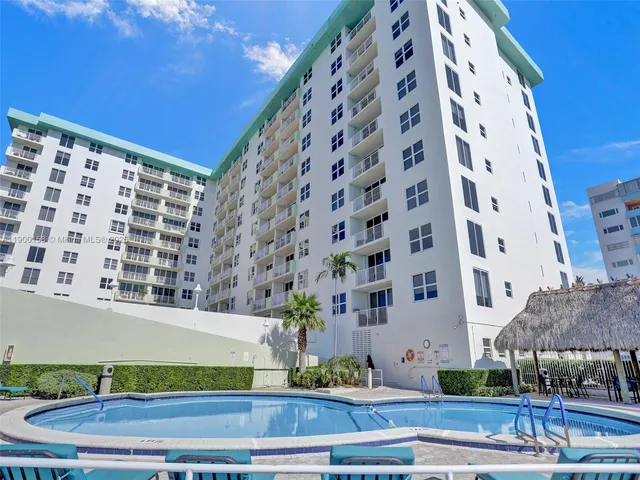 a view of a livingroom with furniture and a potted plant