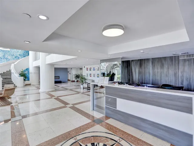 a view of a large building with potted plants